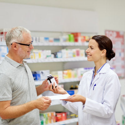 woman holding a bottle of medicine