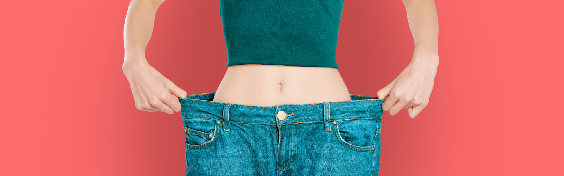 Woman with too large jeans showing off her weight loss